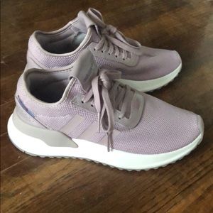Pair of pink/purple adidas shoes